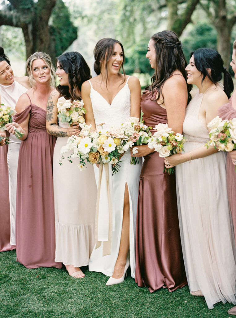 Bridesmaids dressed in pink at a summer wedding in Charleston