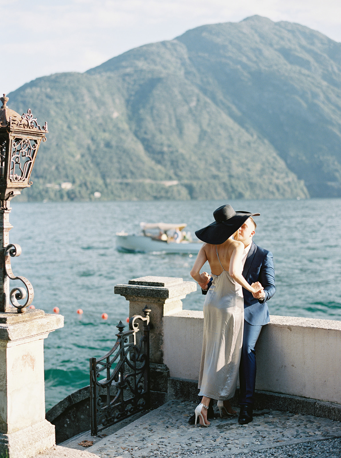 Couple leaning in for a kiss during their portrait session in Lake Como