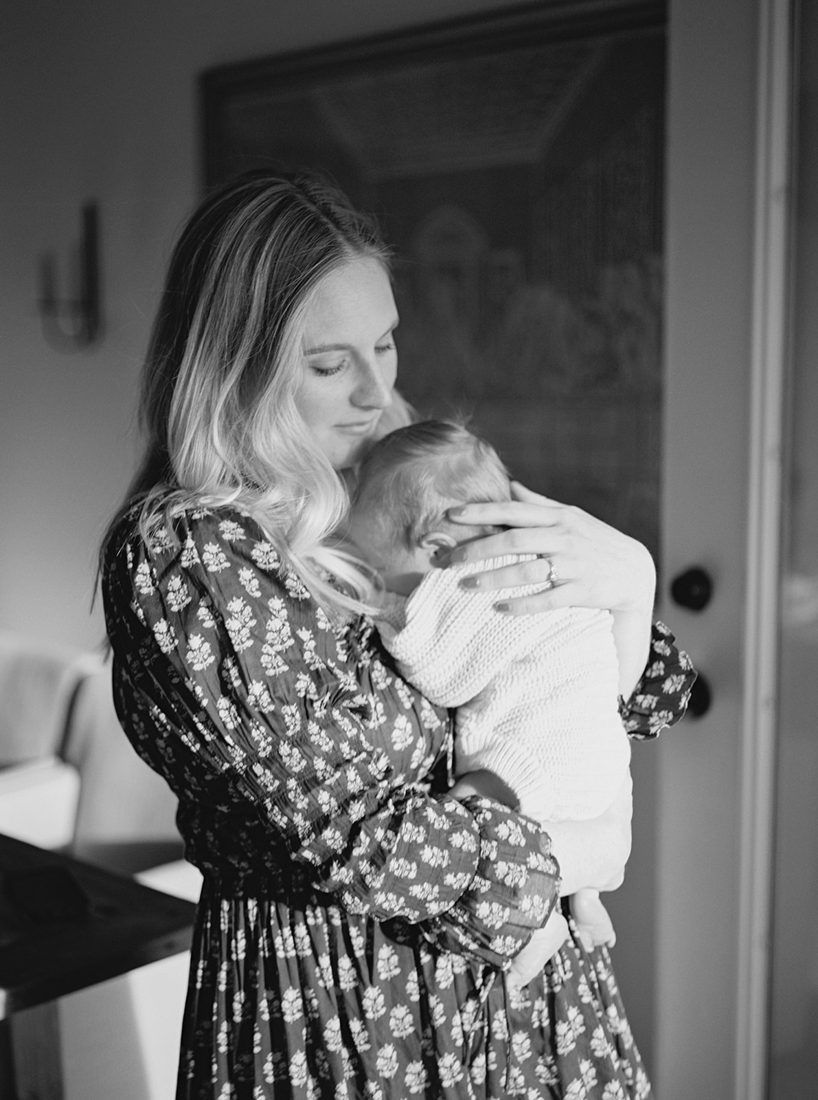 Black and white portrait of mother and baby during in-home family session in Nashville, Tennessee