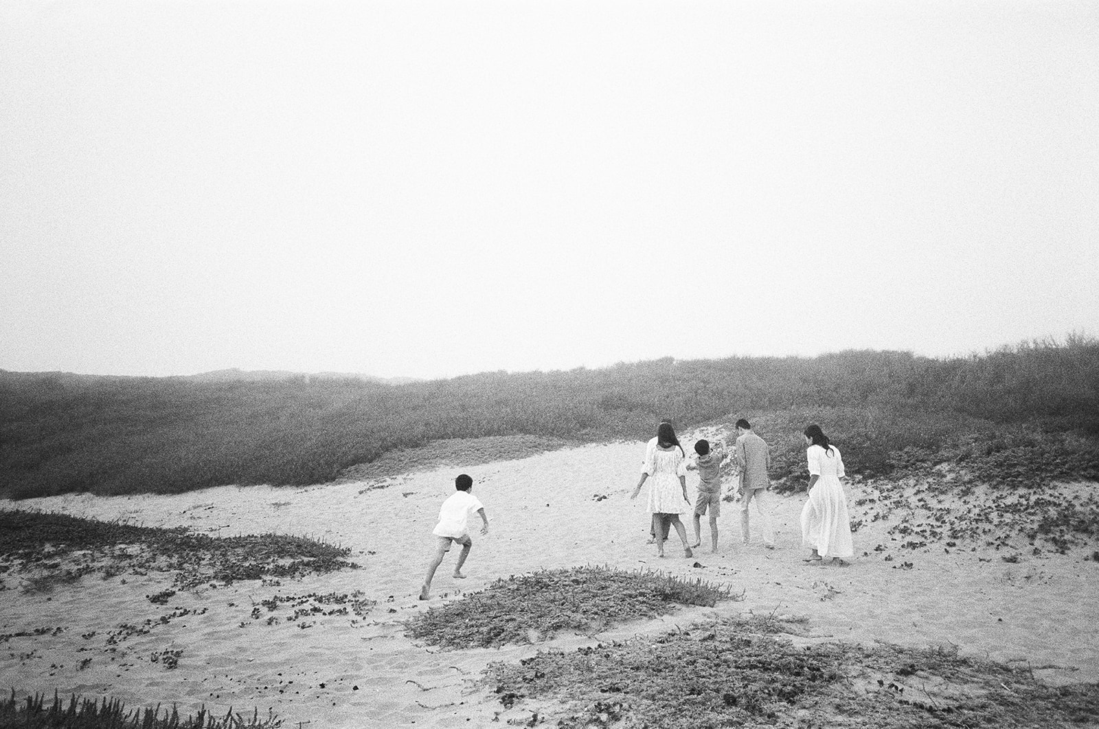 Family walks down the beach in Santa Cruz during their Northern California family session